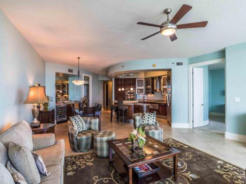 a living room with a couch and a table at Bella Luna #404 in Orange Beach