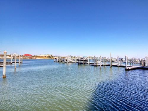 a dock in the middle of a body of water at Bella Luna #404 in Orange Beach