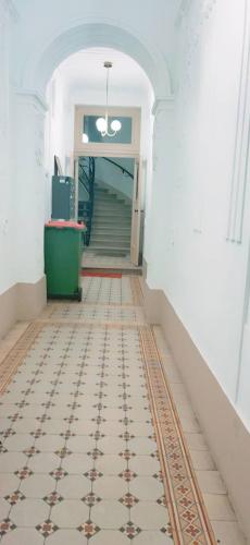 an empty hallway with a tile floor and stairs at Standard Apartment 5P TH in Vienna
