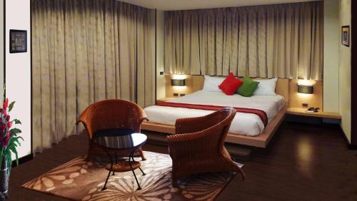 Cama o camas de una habitación en Karon Suite Apartment
