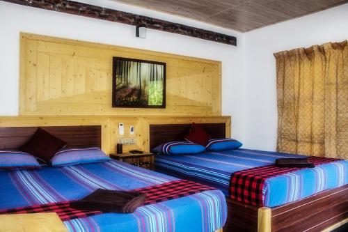 - une chambre avec 2 lits dans l'établissement Green Cottage, à Anurâdhapura