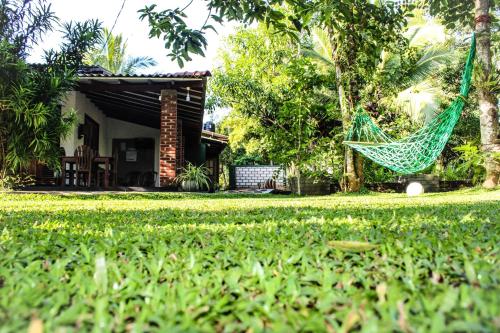 a hammock in the yard of a house at Green Cottage in Anuradhapura