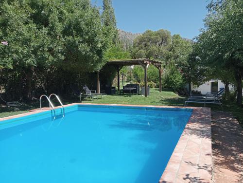 The swimming pool at or close to Casa Rural La Maquinilla