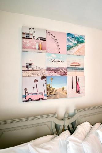 a collage of photos on a wall above a bed at Cobmin Ridge Motel in Branchville