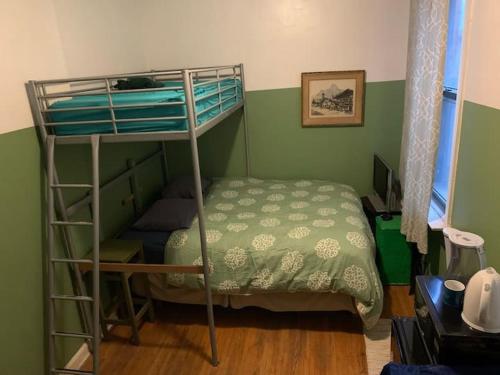 a bedroom with a bunk bed and a bunk bed gmaxwell gmaxwell gmaxwellythonythonython at John 3 16 Christian BnB in New York