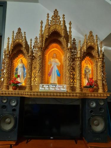 a altar with two statues of nuns on it at Nhà Nghỉ An Toàn in Vung Tau
