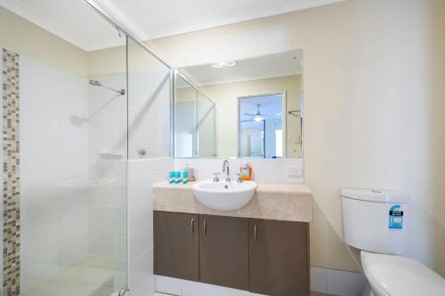 a bathroom with a sink and a shower at Seventy at Cape View Resort in Busselton