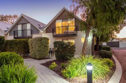 a house with a street light in front of it at Seventy at Cape View Resort in Busselton