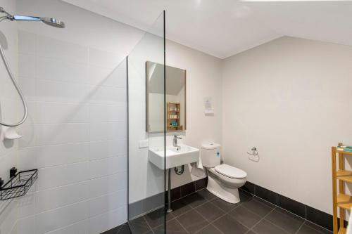 a bathroom with a toilet and a sink at Vasse NewYorker Townhouse in Vasse