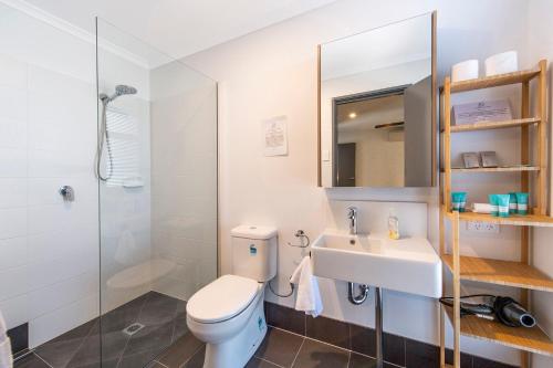a bathroom with a toilet and a sink and a shower at Vasse NewYorker Townhouse in Vasse
