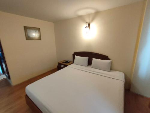 Ένα ή περισσότερα κρεβάτια σε δωμάτιο στο INTERTOWER HOTEL (SHA)