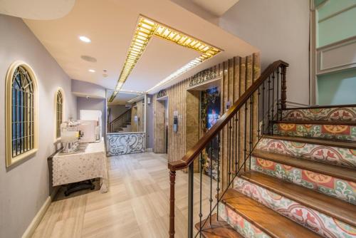 a hallway with a staircase in a house at La Petite Salil Sukhumvit 11 in Bangkok
