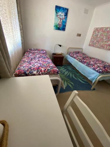 Una cama o camas en una habitación de ADA Homestay