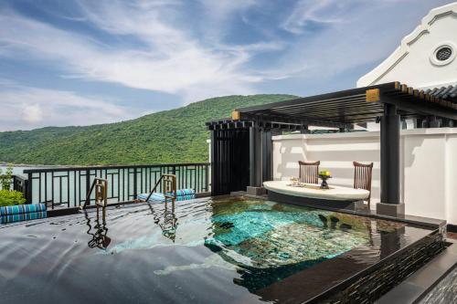 a swimming pool on the roof of a house at InterContinental Danang Sun Peninsula Resort by IHG in Danang