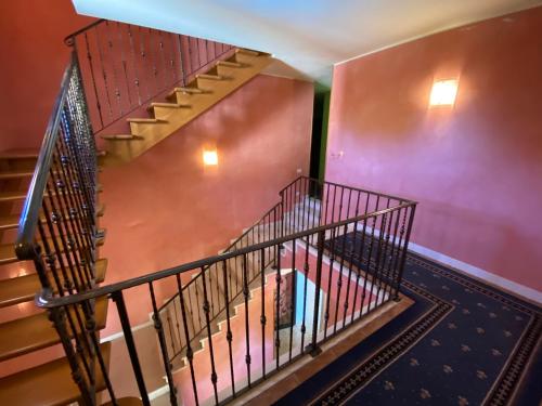 an overhead view of a spiral staircase in a building at Cà Rocca Relais in Monselice