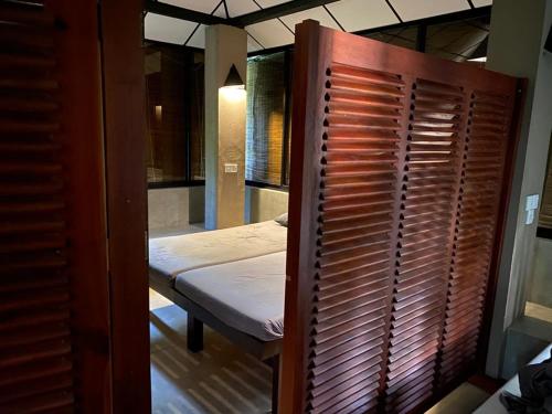 a small room with a bed and a window at Yala Villa in Yala