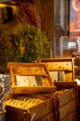 two wooden boxes of food sitting on a table at Hai Tian Expo Hotel in Qingdao