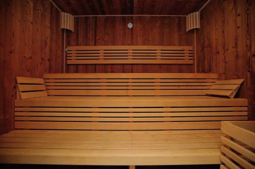 a church with wooden benches in a room at Hotel Aldo in Uničov
