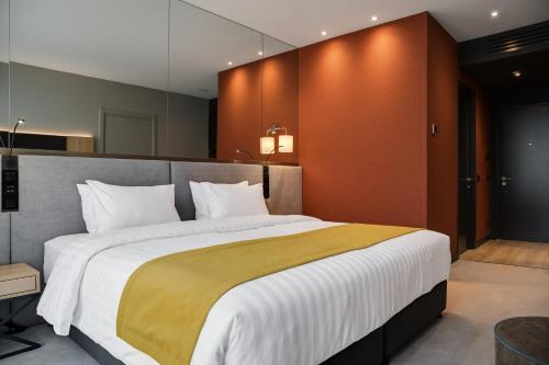 Una cama o camas en una habitación de Glarros OldTown