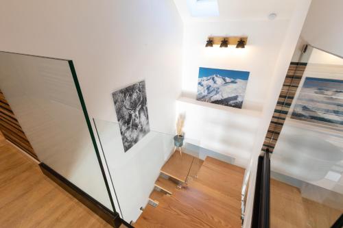 a room with two pictures on the wall at Lodge ou Gîte de caractére avec jaccuzi spa piscine in Argelès-Gazost