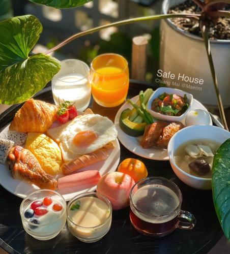 a tray of breakfast foods on a table at S.House168 in Chiang Mai