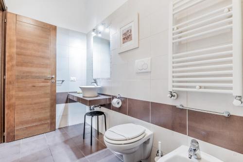 a bathroom with a toilet and a sink at Vatican City Guest House in Rome