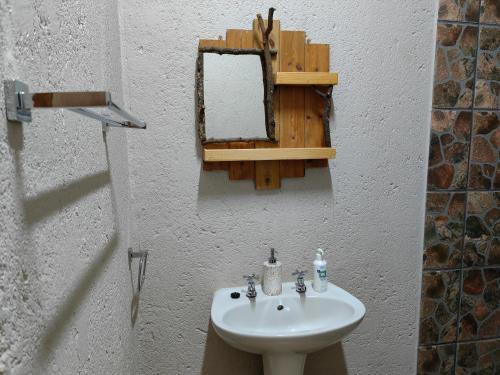 a bathroom with a sink and a mirror on the wall at Mountain Valley Stay - UNIT 3 in Nelspruit