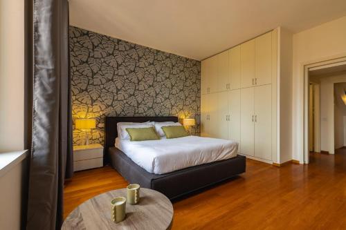 a bedroom with a bed and a table in it at Navona 49 Luxury Suites&Apartment in Rome