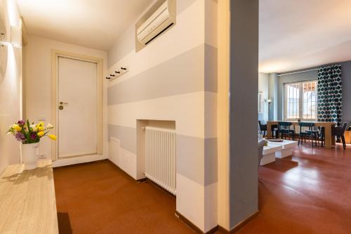 a living room with a large white wall at Navona 49 Luxury Suites&Apartment in Rome