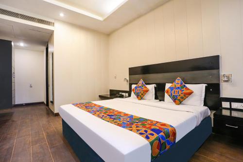 a bedroom with a large bed in a room at FabHotel Posh Classic in Gurgaon