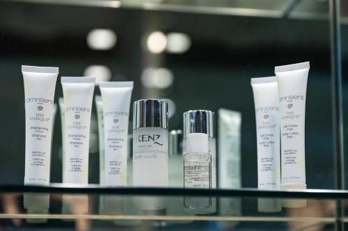 a shelf with a bunch of different types of hair products at Navona 49 Luxury Suites&Apartment in Rome