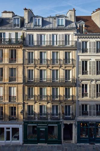 a large building with balconies on the side of it at Grand Hôtel Malher in Paris