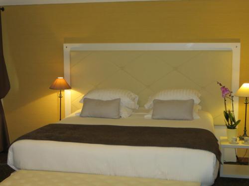 Ein Bett oder Betten in einem Zimmer der Unterkunft Casa Di Lucia Mi-Hotel