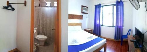 a bathroom with a bed and a bathroom with a toilet at Casa Montemar Bed and Breakfast in Coron