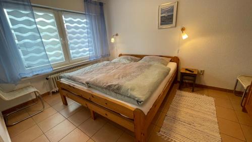Postel nebo postele na pokoji v ubytování Ferienhaus Pelikanstr 44a
