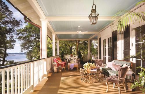 a screened porch with a view of the ocean at Montage Palmetto Bluff in Bluffton