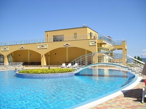 a building with a large swimming pool with a building at Midia Grand Rezort in Aheloy