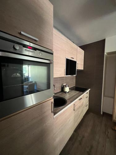 Kuchyň nebo kuchyňský kout v ubytování Une-max