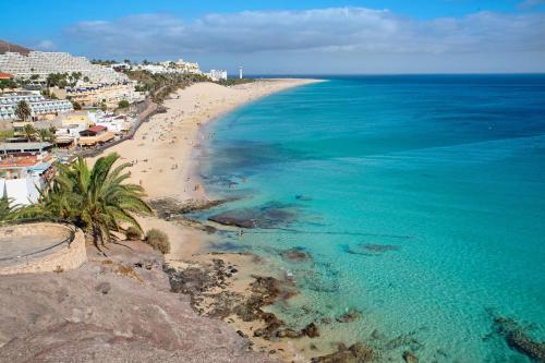 an aerial view of a beach and the ocean at Casa Mar y Luz in Morro del Jable