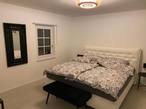Llit o llits en una habitació de Hof Busen Malibu