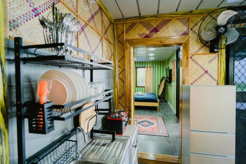 a kitchen with a stove and a refrigerator at Vafi Hills Bed And Breakfast in San Isidro