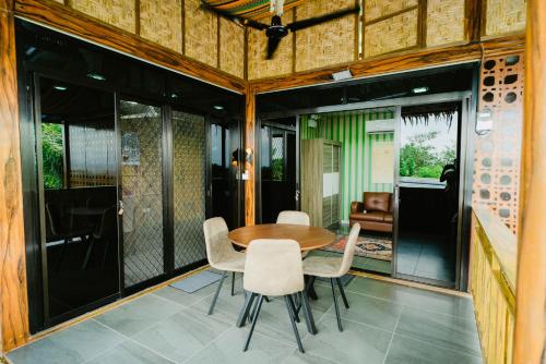 a dining room with a table and chairs at Vafi Hills Bed And Breakfast in San Isidro