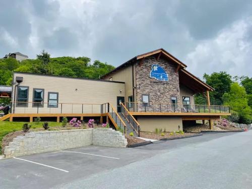 a large building with a parking lot in front of it at Come feel what it's like to relax at 4900' in Sugar Mountain