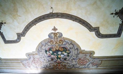 a painting on the wall of a room at CASA BELGERI - Bed & Breakfast in Dongio