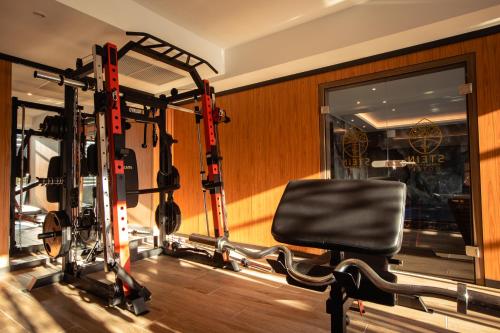 a room with a gym with a chair in it at Hotel Stein Collection in Timişoara