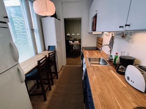 a kitchen with a sink and a counter top at Cosy Big 2 room apartment in Helsinki