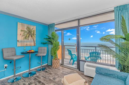 a living room with a view of the ocean at Landmark 830 in Myrtle Beach