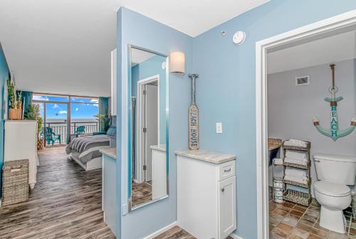 a bathroom with a toilet and a sink at Landmark 830 in Myrtle Beach