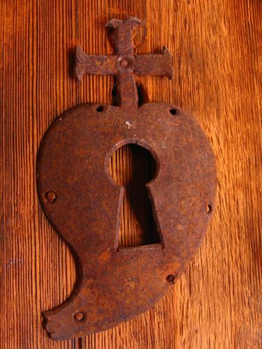 a rusted number on top of a wooden table at Palacio Borghese Hotel Boutique - Adults Only in Oaxaca City