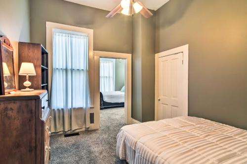 a bedroom with a bed and a ceiling fan at Bright Apartment, Near Vicksburg Military Park! in Vicksburg